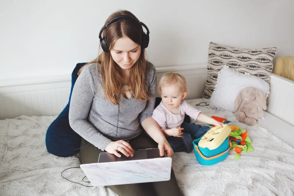 Work life balance for moms - mom working with baby nearby